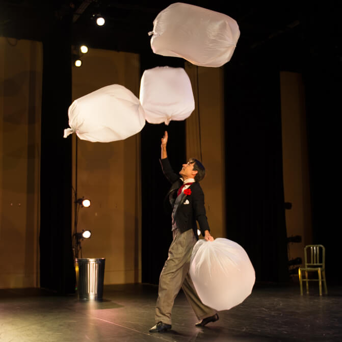Peter Davison dancing with garbage bags